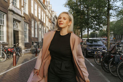 Full length of woman on street in city