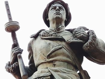 Low angle view of statue against sky