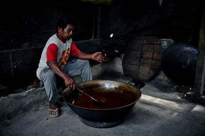 Full length of man preparing food