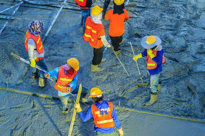 High angle view of people working in water