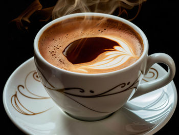 Close-up of cappuccino on table