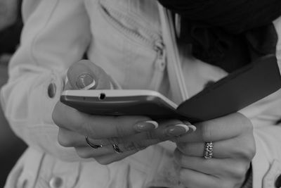 Midsection of woman using phone