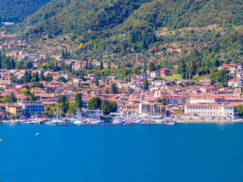 Scenic view of sea and buildings in city