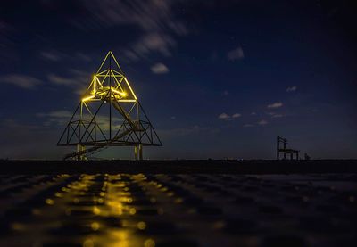 Ferris wheel against sky at night