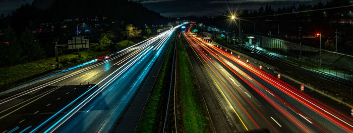 High angle view of light trails on highway at night