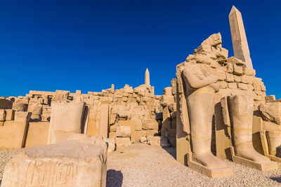 Historic temple against clear blue sky