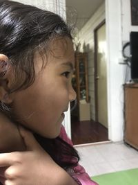 Portrait of a girl looking away at home