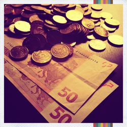 High angle view of coins on table