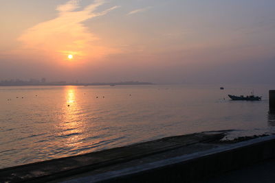 Scenic view of sea against sky during sunset