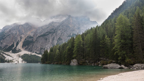 Scenic view of lake and mountains against sky