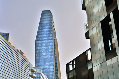 Low angle view of modern buildings against clear sky