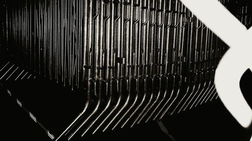 Close-up of metal object over white background