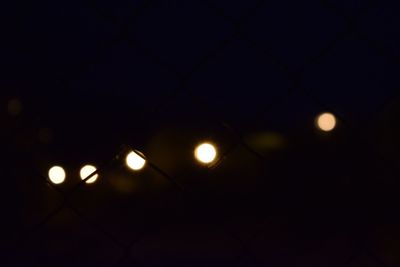 Close-up of illuminated lights at night