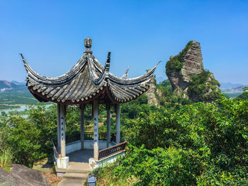 Gazebo on ground against clear sky