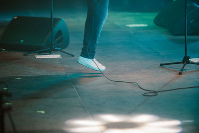 Low section of man standing on stage