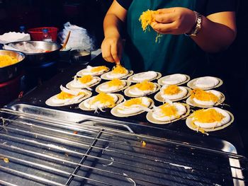 Midsection of woman preparing food