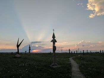 Scenic view of field against sky during sunset