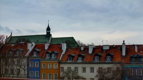 Low angle view of building against cloudy sky