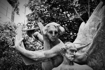 Portrait of man holding elephant