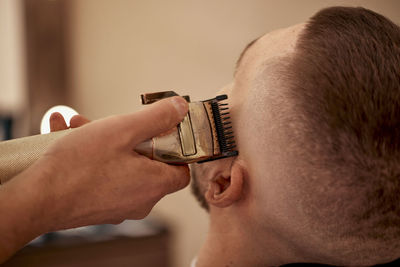 Close-up of man using mobile phone