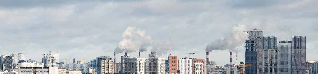 Skyscrapers in city against sky