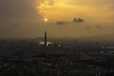 High angle view of buildings against sky during sunset