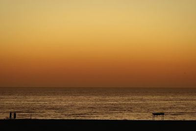Scenic view of sea at sunset