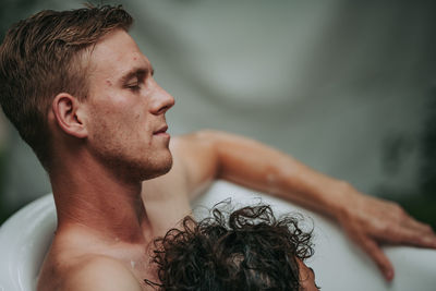 Close-up portrait of shirtless man