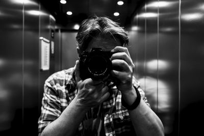 Portrait of woman photographing