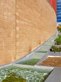 Fountain against stone wall