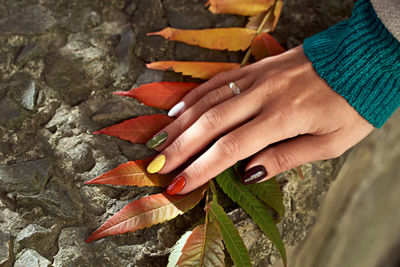 Close-up of woman hand holding rock