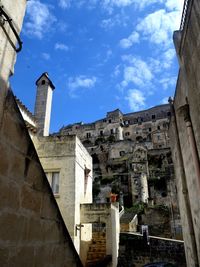 Low angle view of old buildings against sky