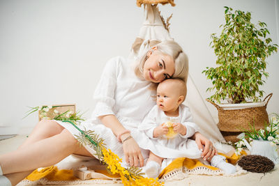 Portrait of young woman holding bouquet