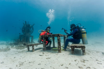 People scuba diving underwater