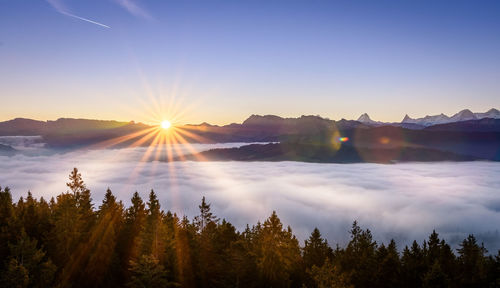 Scenic view of mountains against sky during sunset