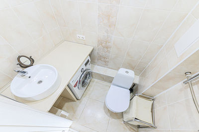 Apartment room bathroom, sink, decorative elements, toilet