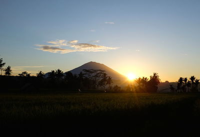 Scenic view of landscape against sky during sunset