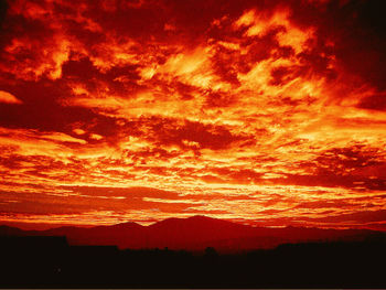 Scenic view of dramatic sky during sunset