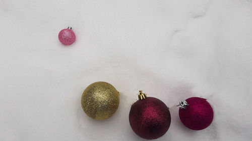 High angle view of fruits on table against white background