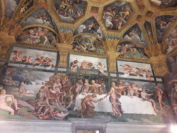 Low angle view of sculptures on ceiling of temple