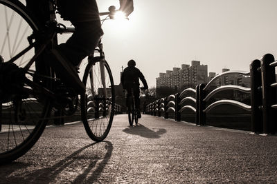 People riding bicycle in city
