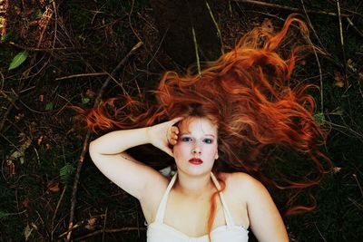 Portrait of young woman in field