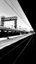 Railroad tracks against clear sky