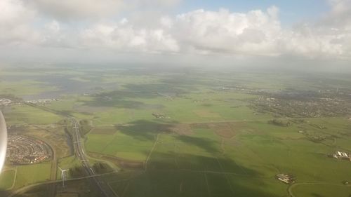 Aerial view of agricultural landscape against sky
