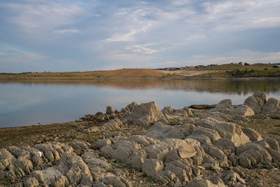 Lucefecit dam in terena with reflection on the lake reservoir, in portugal