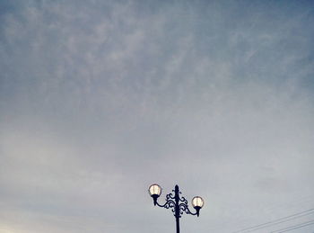 Low angle view of street light against sky