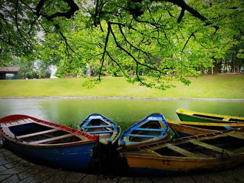 Boats moored in lake