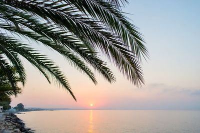 Scenic view of sea against sky at sunset