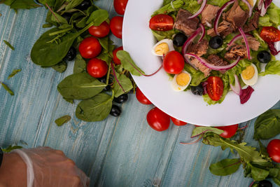 High angle view of cherries in plate on table