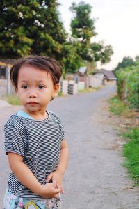 Portrait of cute girl standing outdoors